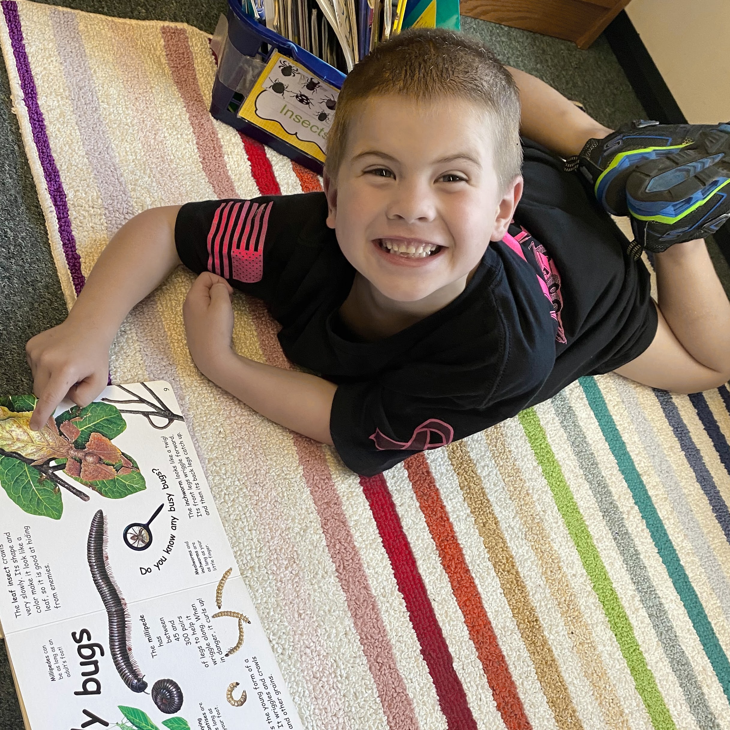 Student reading insect book